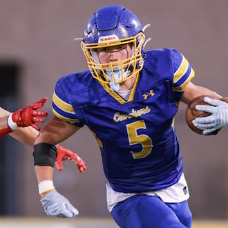 Lehman Catholic senior receiver Evan O'Leary runs with pressure from Northridge's Dylan Truesdale during a Three Rivers Conference game on Thursday, Sept. 11 at Sidney Memorial Stadium. BRYANT BILLING / STAFF