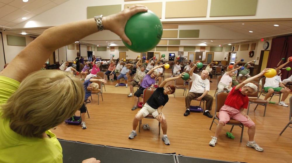 People take part in a Silver Sneakers Fitness Program. STAFF