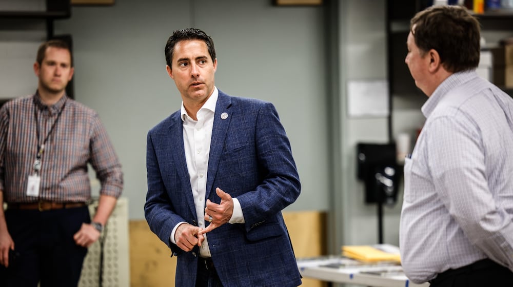 Director of the Montgomery County Board of Elections, Jeff Rezabek, right, fields questions by Ohio Secretary of State, Frank LaRose at the Montgomery County Board of Elections on Monday May 2, 2022.