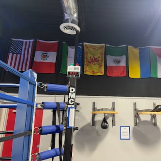 The gallery of champions’ flags hangs above the ring in the DMC Boxing Academy. They represent (left to right): United States, Peru, Uzbekistan, Scotland, Mexico, Ukraine, Palestine and Guatemala. TOM ARCHDEACON/CONTRIBUTED PHOTO