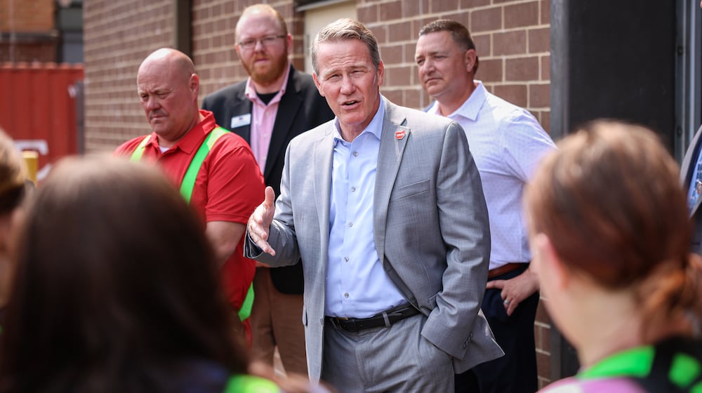 Sen. Jon Husted talks to Stebbins High School students on Friday, Sept. 5 during a tour of the school's career technology center. BRYANT BILLING / STAFF