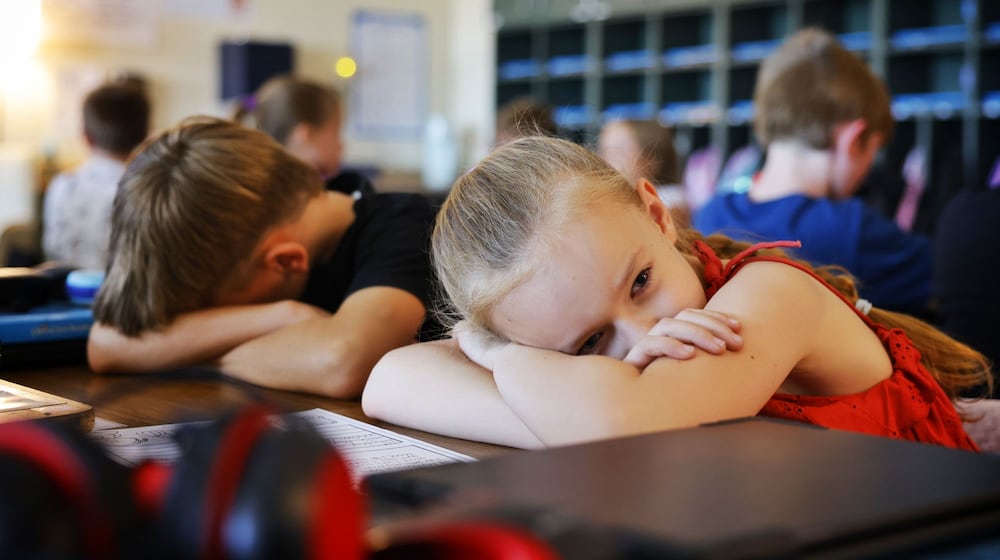Grace Adleta and fellow students in Mo Whitacre's third-grade classroom take a few minutes to relax to music during a music therapy session Monday, Sept. 8, 2025 at Monroe Elementary School. NICK GRAHAM/STAFF